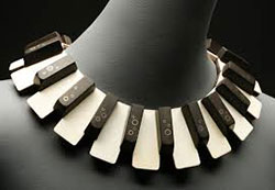 Donald Stuart, "Diana Krall." Necklace, antique piano keys, 14K gold inlays, sterling silver, walnut.