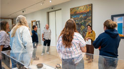 Liz Celeste giving a tour in the museum's promenade.
